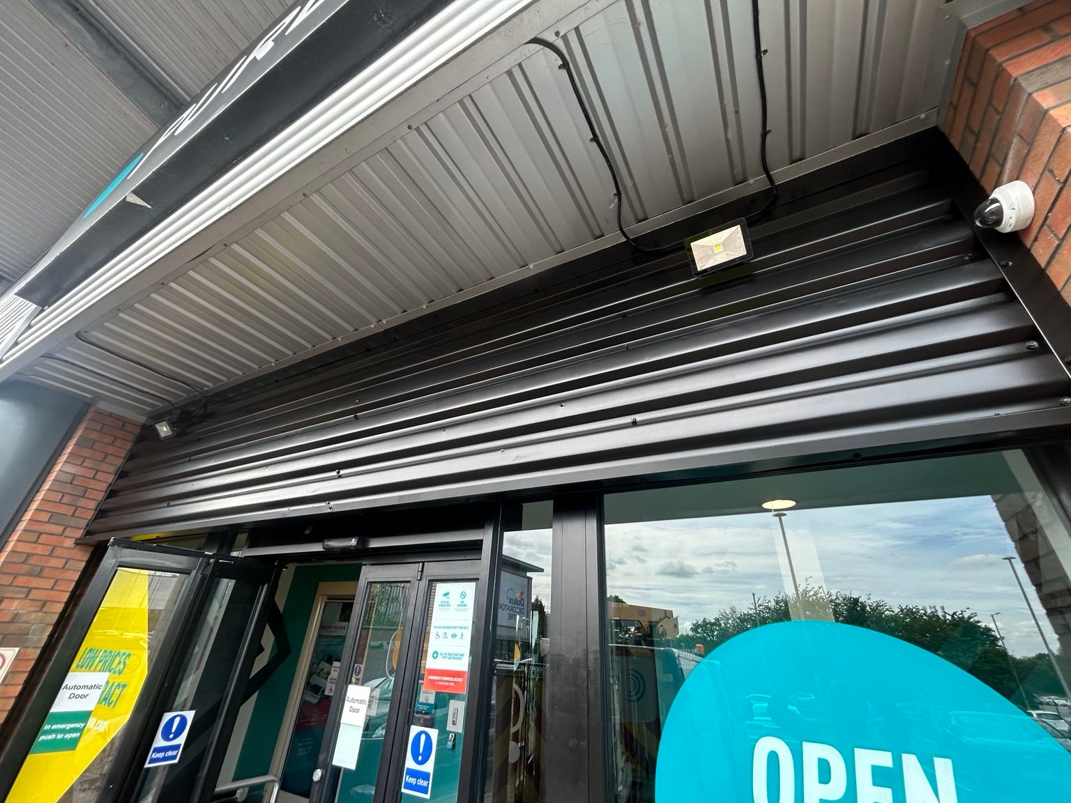 Retail entrance and shutter finish